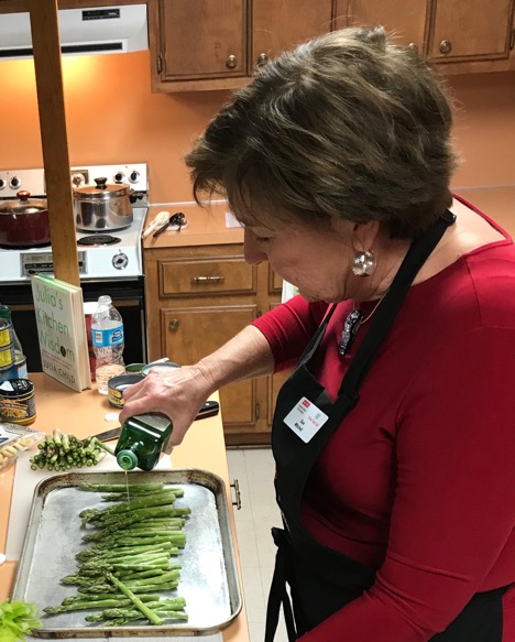 woman cooking asparagus